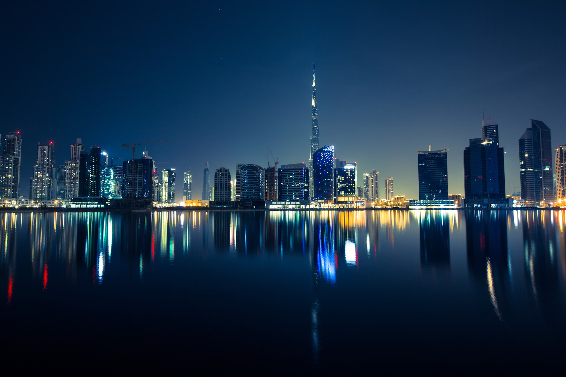Modern global financial skyline at night